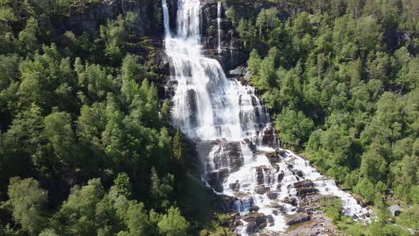 Famous Tvindefossen aerial approaching with view from top to bottom - Voss Norway