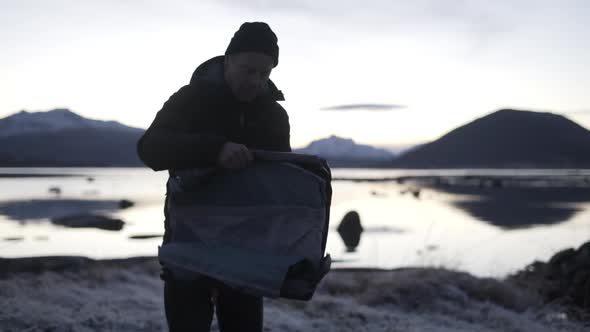 Man Preparing Tent In Winter