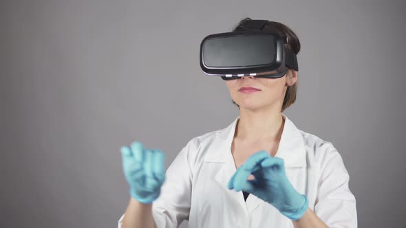 Feale Doctor Conducting Experimental Medical Procedure Wearing Virtual Reality Headset Isolated on