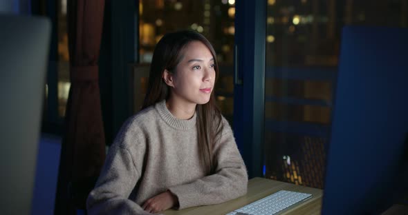 Woman work on computer at night