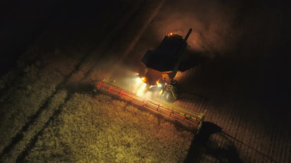 Night Time Harvest Using a Large Combine Harvester in a Field