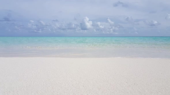 Aerial drone view seascape of paradise lagoon beach break by blue ocean with white sandy background 