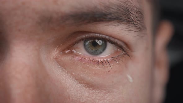 Closeup Shot of Crying Man with Tears in Eye