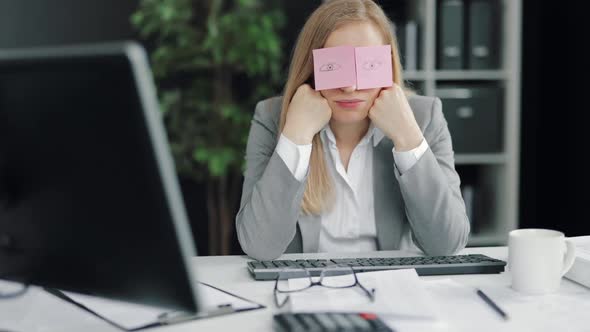 Tired Woman Sleeping at Workplace