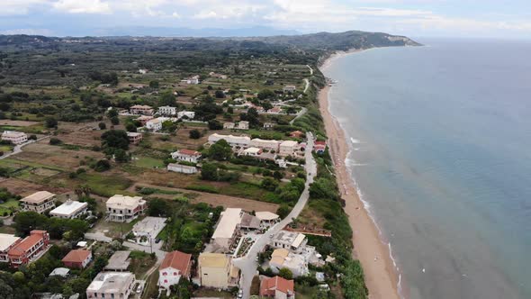 Beautiful aerial footage of the Agios Georgios Beach and coastal village called St George South 