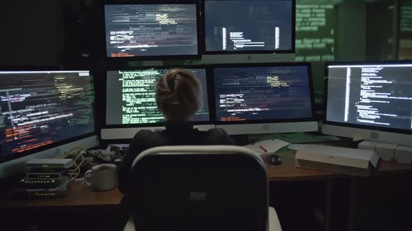 Woman Programmer Working with Data at Night