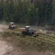 Aerial view of Trucks bring haylage to the Silo Trench, tractors tamp the silage 01 - VideoHive Item for Sale