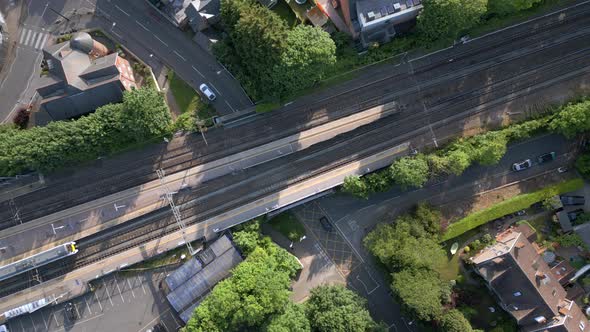 Trains Stopping at a Station in the UK Aerial View