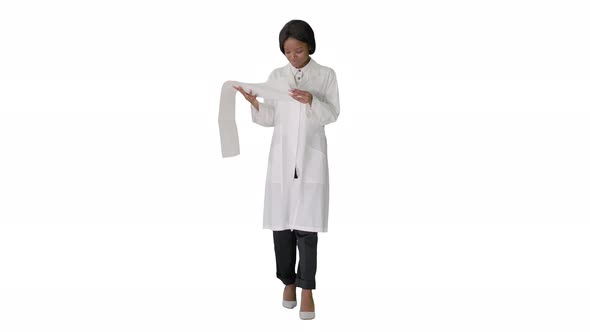 Smiling African American Female Doctor Reading Cardiogram on White Background