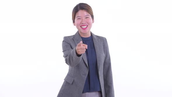 Happy Young Asian Businesswoman Pointing at Camera
