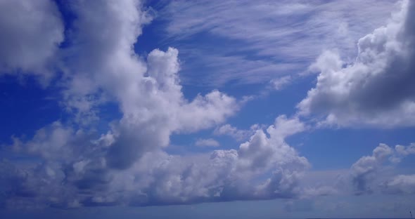 Luxury flying abstract view of a white sand paradise beach and aqua blue ocean background in high re