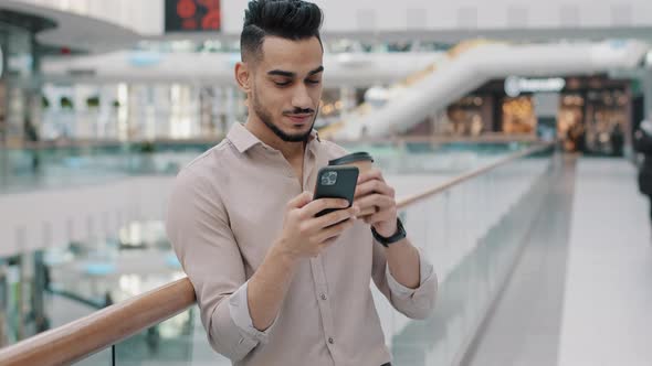 Arabic Man Hispanic Guy in Shirt with Coffee Indian Businessman Looking at Mobile Phone Screen