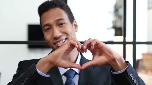 Heart Sign by Black Businessman