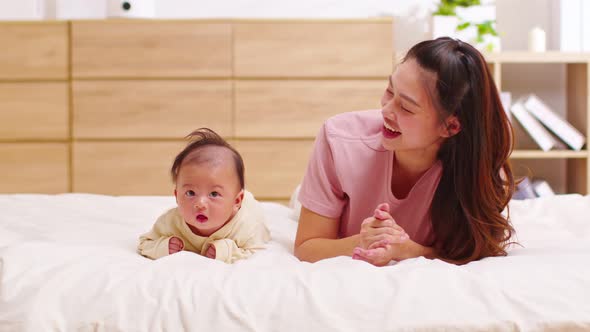 Newborn baby 4 month laying on stomach developing neck control .tummy time for strengthen baby neck