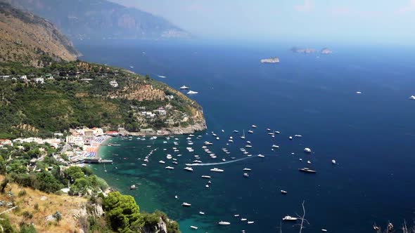 Beautiful Amalfi Coastline With Boats Moored Off Beach. High Angle, Locked Off