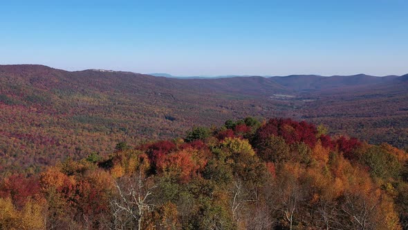 An aerial shot orbiting TIbbet Knob on the Virginia/West Virginia border. Great North Mountain, the