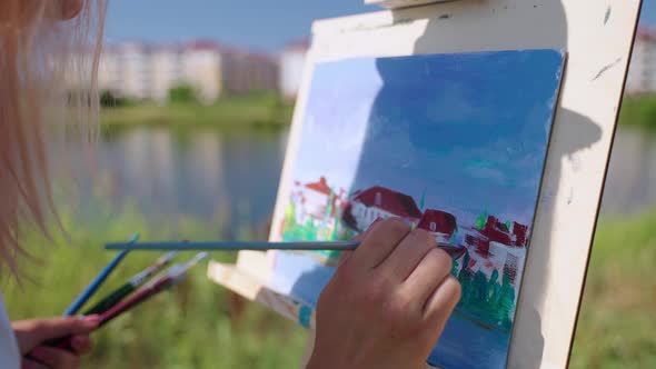 Painting Cityscape From Nature in Park on Coast of Picturesque Lake