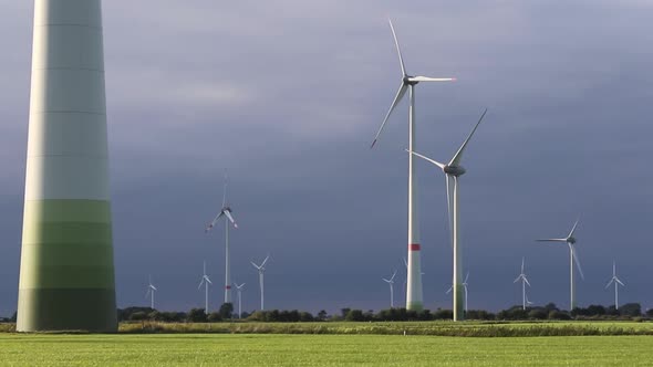 Wind Turbines on farmland. East Frisia. Lower Saxony. Germany. 2020