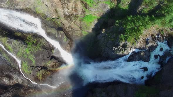 Aerial top-down view of massive Voringfossen waterfall in Norway.