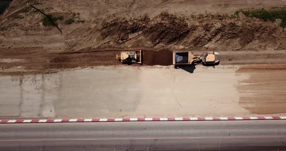 Road Construction Site Near the Highway with Machinery, Bulldozer, Excavation From Above. Video, Top