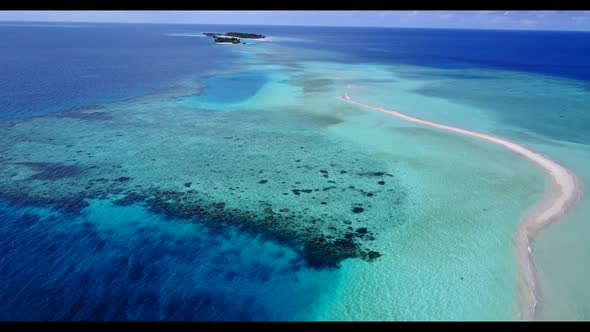 Aerial drone seascape of exotic seashore beach break by blue ocean with white sand background of a d