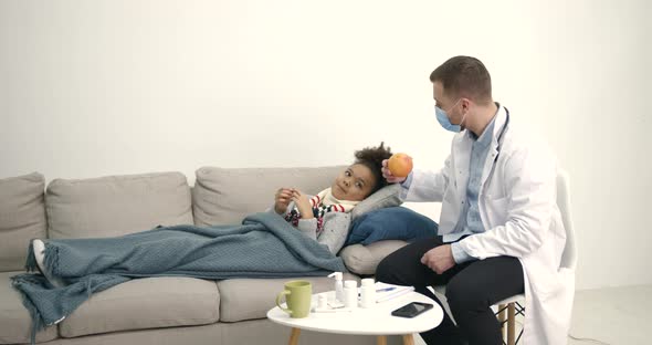 Pediatrician at Home Visiting Helping Little Black Girl