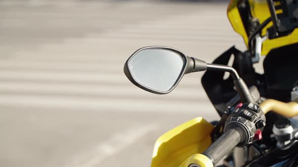 Rearview Mirror of a Beautiful Yellow Motorcycle