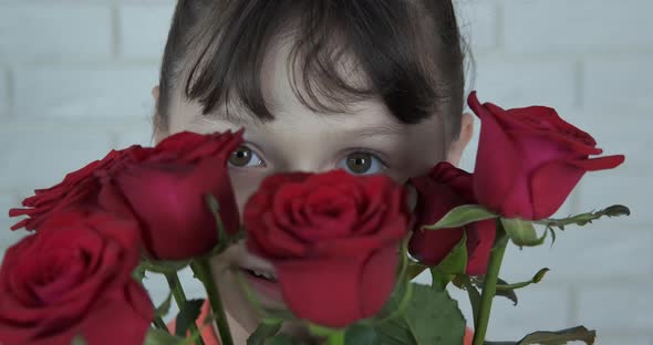 Happy Child Face in Roses