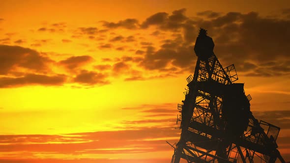 Telecommunication Tower With Tv Antenna In Sunset alt