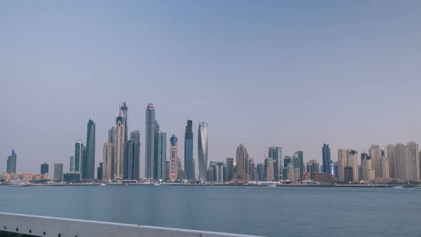 Dubai Marina Skyline Day to Night Timelapse As Seen From Palm Jumeirah in Dubai UAE