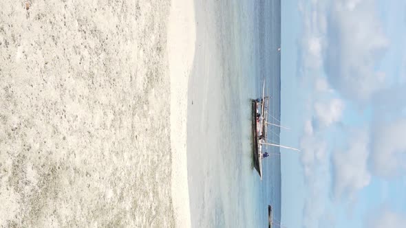 Vertical Video Boats in the Ocean Near the Coast of Zanzibar Tanzania Aerial View