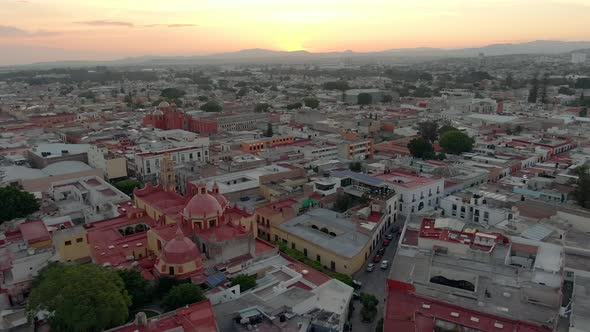 Fly Over Our Lady Of Guadalupe To San Antonio de Padua Templo At Sunset In Santiago de Querétaro, Me