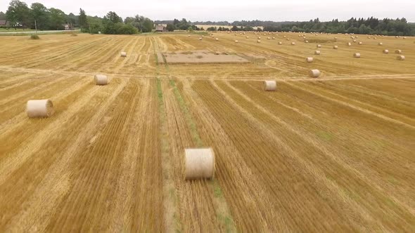 balls of hay on field drone shot in Estonia