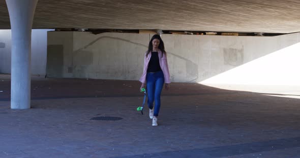 Woman walking under flyover