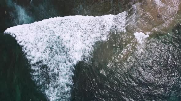 Aerial Drone Footage of Surfers Waiting for the Next Ride on the Big Ocean Wave on Beautiful Aerial