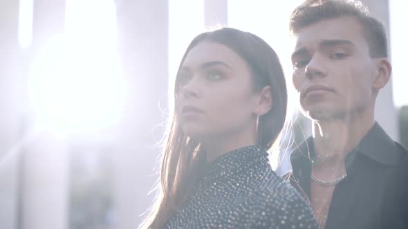 Closeup of Young Beautiful Caucasian Couple Standing in Sunlight Outdoors