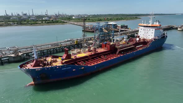 Fuel Tanker Vessel Offloading Petroleum Cargo for Processing at a Refinery