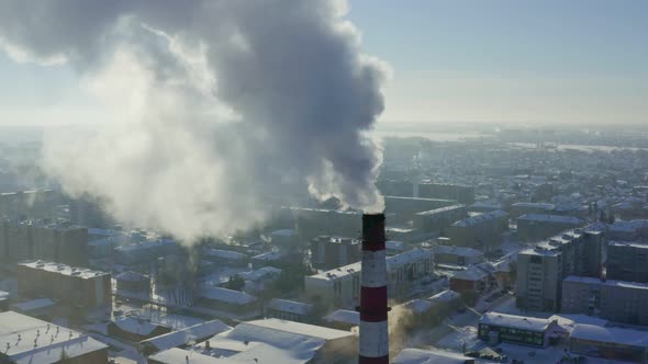 The smoke from the pipes of plant pollutes the environment.