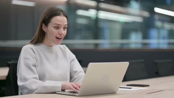 Successful Woman Celebrating on Laptop