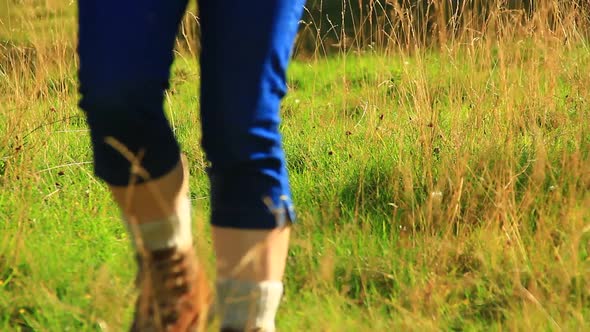 Woman Walking from the Mountains