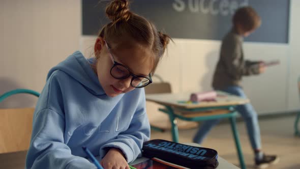 Focused Child Studying in Class