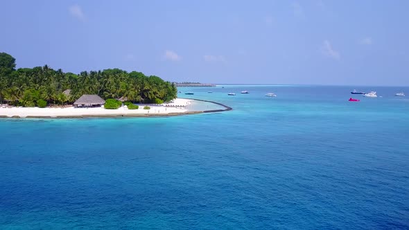 Aerial drone panorama of shore beach by blue ocean and sand background