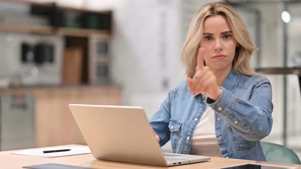 Young Casual Woman with Laptop Showing No Gesture, Disapprove 