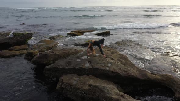 Drone Flies Around Beautiful Young Flexible Woman Athlete Yoga