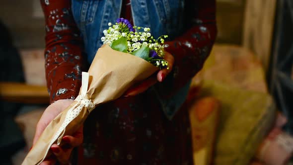 Florist Giving Modern Bouquet to Man at Flower Shop.