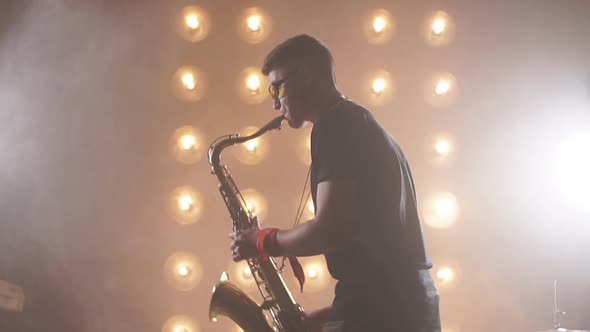 Musician Holding a Saxophone