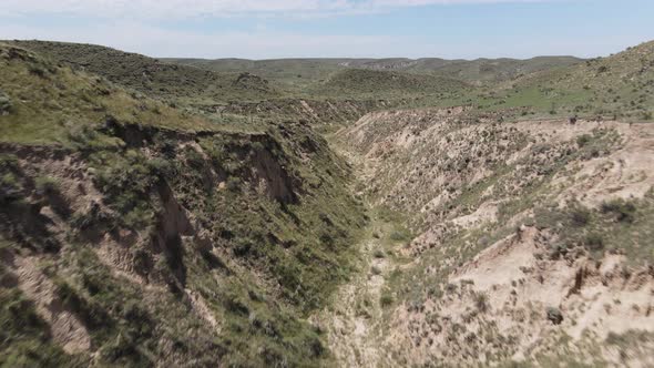 4k drone video of Arikaree Breaks canyon in Kansas during summer.