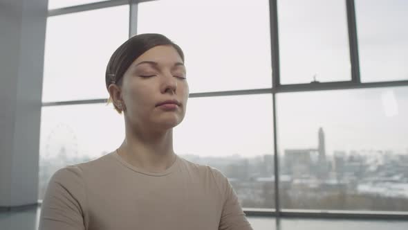 Woman Meditating With Eyes Closed