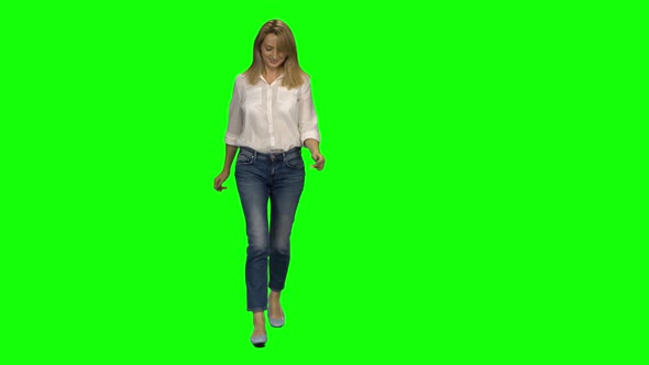 Blonde Woman Is Running with Smile on Green Screen, Chroma Key,  Shot, Front View