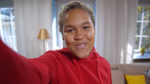 Smiling African American Woman Having Video Call at Home